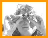 Woman looking through miniature  binoculars