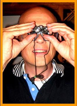 Man using miniature binoculars