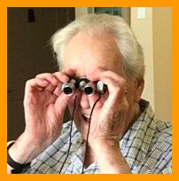 Older Man Enjoying Miniature Binoculars
