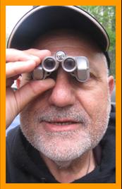 Man observing with pocket binoculars