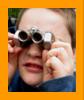 Young Boy looking Through Binoculars