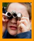 Young Boy looking Through Binoculars