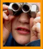 Cute Boy Looking through Binoculars