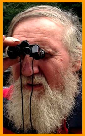 Bearded Man Viewing with Miniature Binoculars