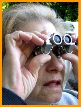 Woman Staring Through Binoculars