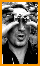 Surprised man looking bthrough binoculars