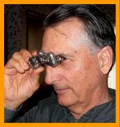 MAn looking through binoculars