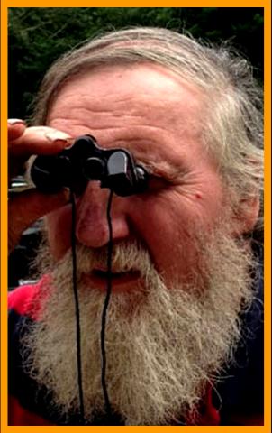 Distinguished man looking through binoculars