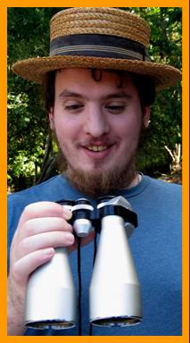 Man in Farm hat with binoculars