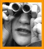 Child looking through miniature binoculars