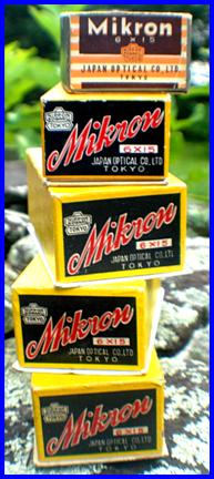 Stack of 1950's Mikron 6x15 binoculars boxes
