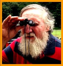 Mountain man using Binoculars