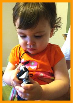 child looking at binoculars