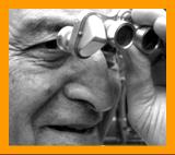 Man looking through binoculars