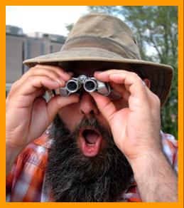 Man Amazed by Miniature Binoculars. www.miniaturebinoculars.com