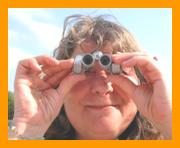 Woman with Miniature Binoculars. www.miniaturebinoculars.com
