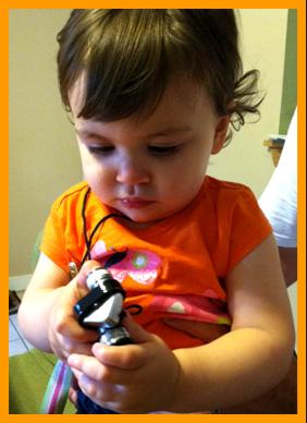 Young Child Gazing at Micro Binoculars