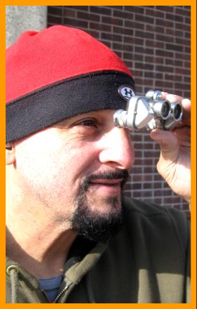 Man Observing with Miniature Binoculars