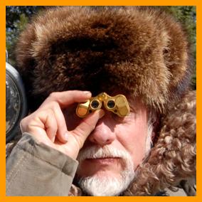  Man in Fur Hat Looking Through Miniature Binoculars