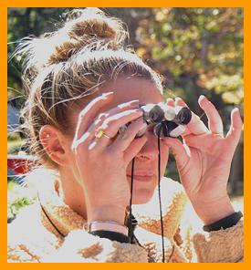 Woman Viewing with Miniature Binoculars