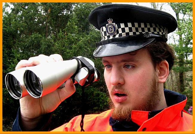 UK Police officer wuth Binoculars