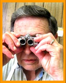 Man using Pocket Binoculars