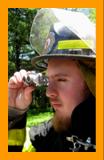 FirefighterObserving with  Miniature Binocular