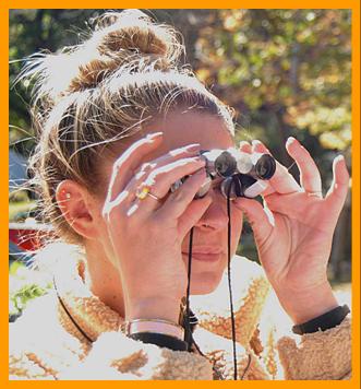 Woman Viewing with Miniature Binoculars