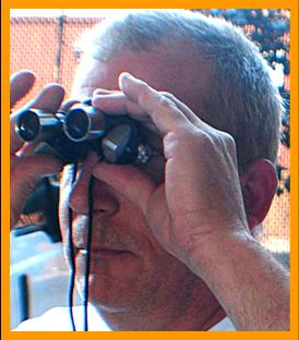 Man w/ small binoculars