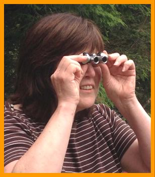 Amused Woman Using Binoculars