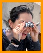 Excited Woman Looking Through Binoculars