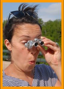 Amazed Woman using Binoculars