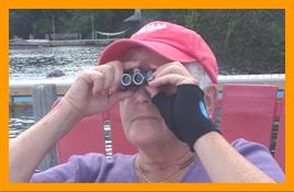 Woman looking for Bears with Binoculars