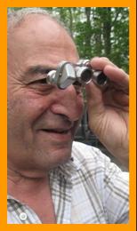 Man Looking for Trouble with Miniature Binoculars