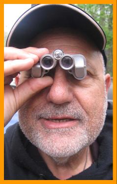 Man using Miniature Binoculars