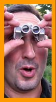 Surprised man with Miniature binoculars