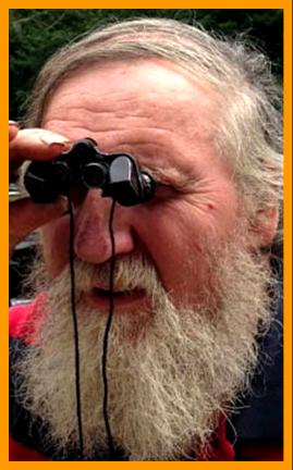 Bearded Man Viewing with Miniature Binoculars