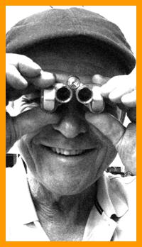 Happy Man Looking Through Binoculars