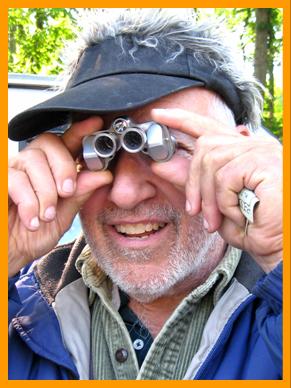 Amused Man with Tiny Binoculars