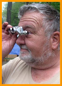Elderly Man with Miniature Binoculars