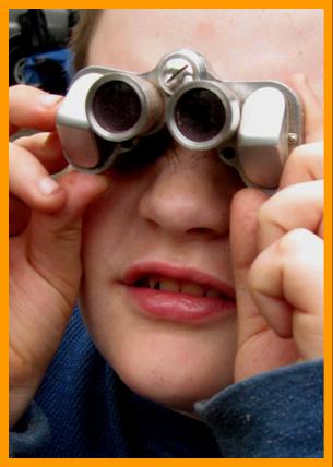 Cute Boy Looking through Binoculars