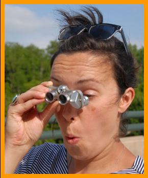 Shocked Woman Looking Through Binociulars