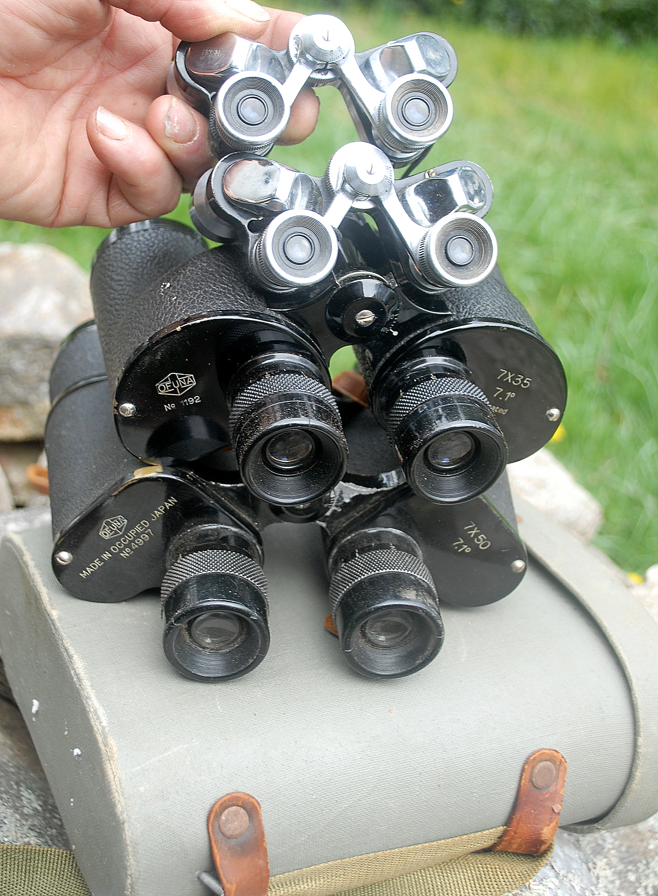 Man Pointing to Binoculars