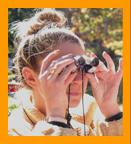 Woman Viewing with Miniature Binoculars