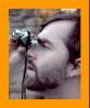 Man looking through miniature binoculars.
Mann schaut durch ein miniatur  fernglas.
Homme regardant a travers de jumelles miniature.
Hombre mirando a traves de binoculares en mimniatura.
Man som tittar genom miniatur kikare.
L'uomo che guarda attraverso il binocolo in miniatura. 