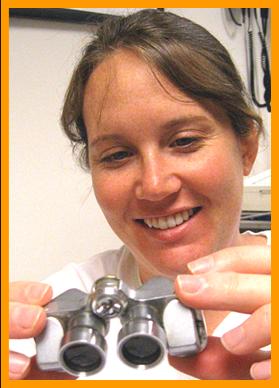 Woman Examining Binoculars