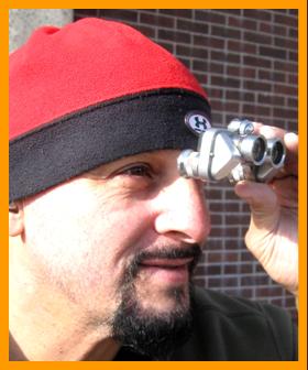 Man Observing with Miniature Binoculars