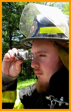 FirefighterObserving with  Miniature Binocular